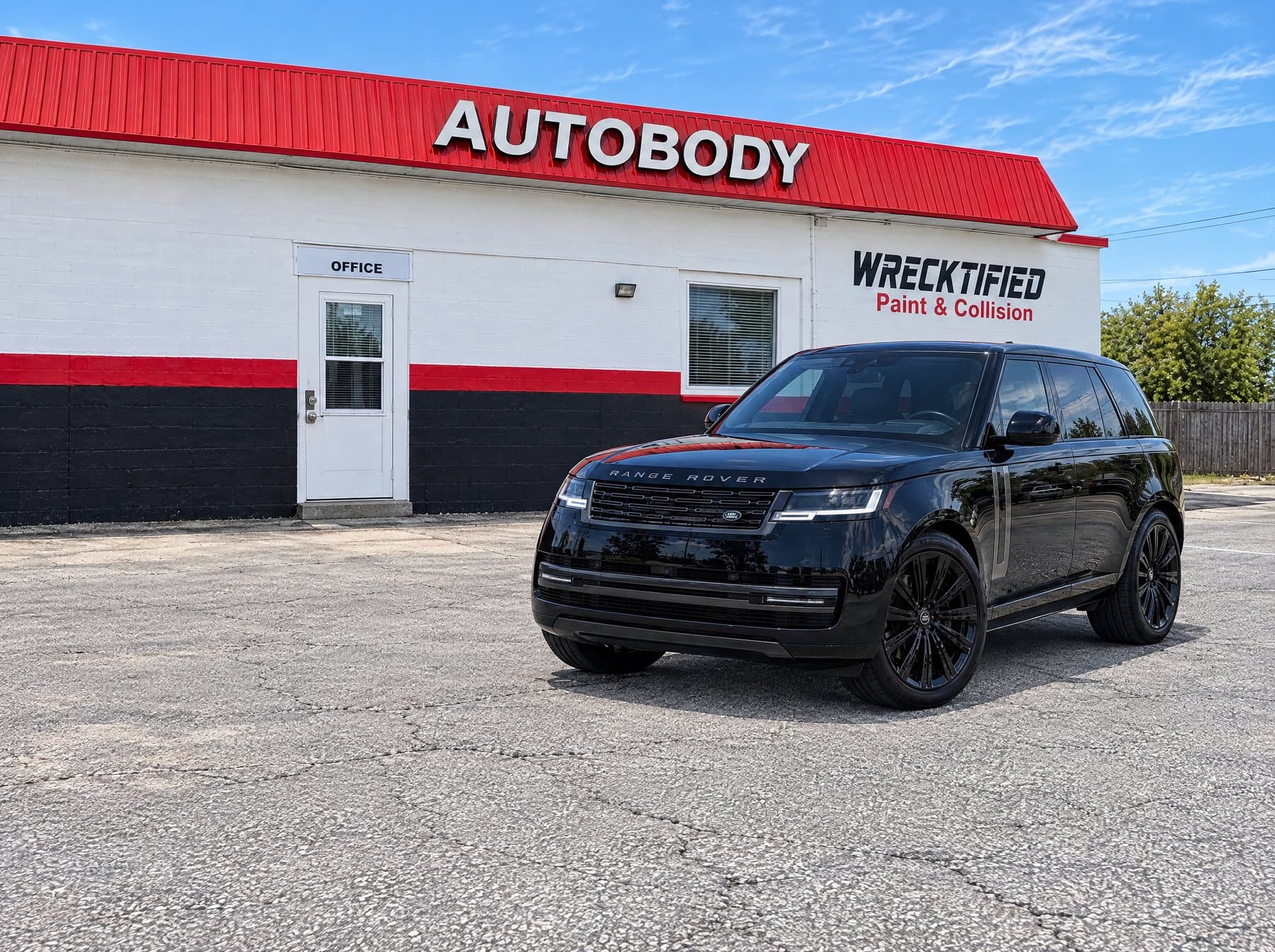 A Range Rover parked at Wrecktified Paint & Collision in Clearwater, FL